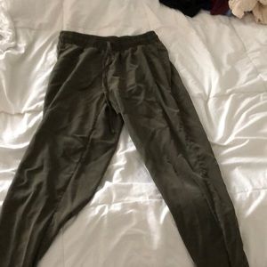 Olive green joggers with zippers on the side